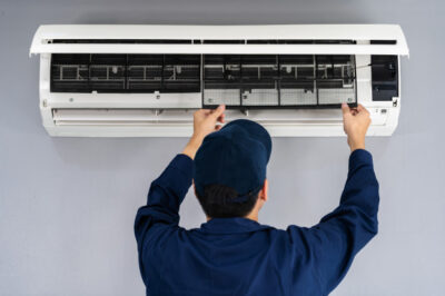 Technician is repairing AC Repair Services in Mirdif