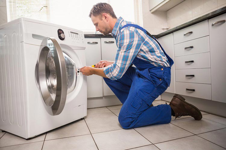 Technician is repairing Dryer in Muhaisnah