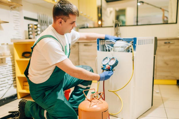Technician is Repairing Fridge